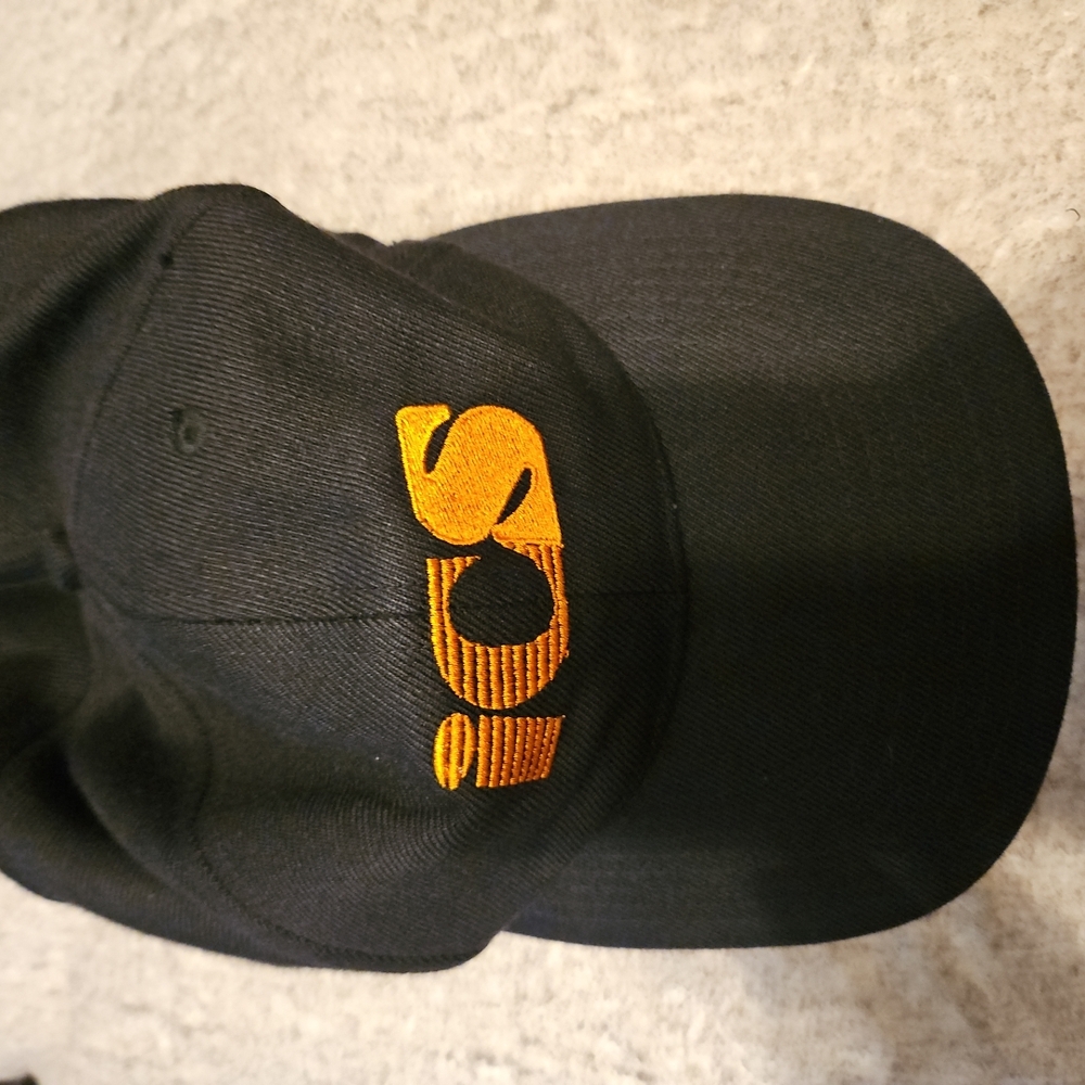 ICS baseball Capp. Black W/ Orange Lettering Mens Hat. (A-43)